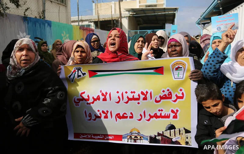 Palestinians take part in a protest against aid cut, in front of the headquarters United Nations Relief and Works Agency (UNRWA) in al-Nusirat refugee camp in the Gaza strip on January 17, 2018 after the White House froz...