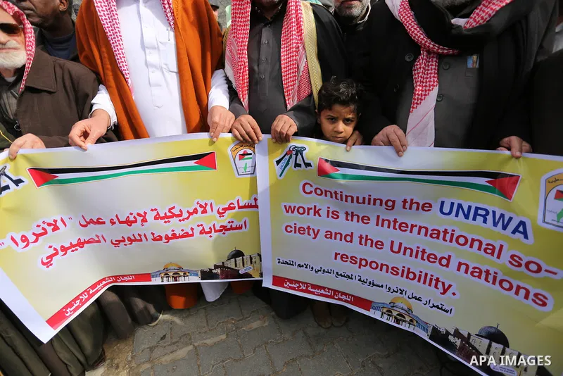 Palestinians take part in a protest against aid cut, in front of the headquarters United Nations Relief and Works Agency (UNRWA) in al-Nusirat refugee camp in the Gaza strip on January 17, 2018 after the White House froz...