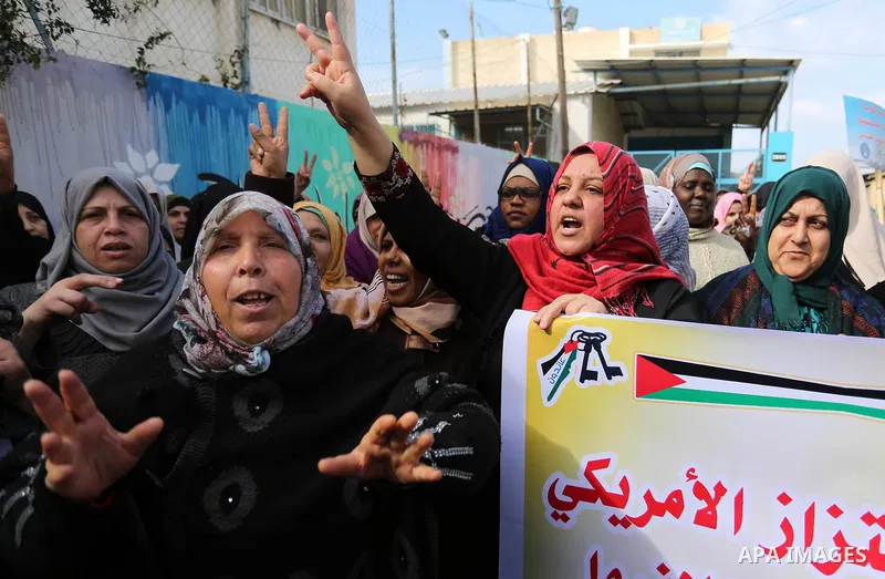 Palestinians take part in a protest against aid cut, in front of the headquarters United Nations Relief and Works Agency (UNRWA) in al-Nusirat refugee camp in the Gaza strip on January 17, 2018 after the White House froz...
