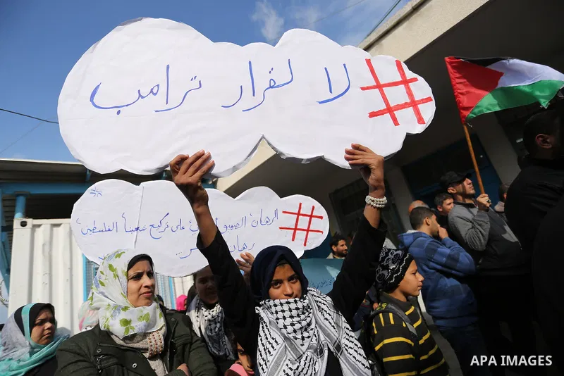 Palestinians take part in a protest against aid cut, in front of the headquarters United Nations Relief and Works Agency (UNRWA) in al-Nusirat refugee camp in the Gaza strip on January 17, 2018 after the White House froz...