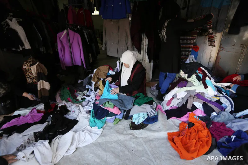 A Palestinian man works at his store at a market in al-Shati refugee camp in Gaza city on January 18, 2018. Gazans are strapped for cash and markets are suffering from an unprecedented recession. Meanwhile, on Dec. 30, f...