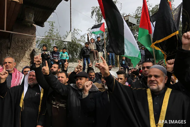 Palestinian supporters of Islamic Jihad take part during a protest against U.S. President Donald Trump's decision to recognise Jerusalem as the capital of Israel, in Gaza city, on January 19, 2018. Photo by Ashraf Amra