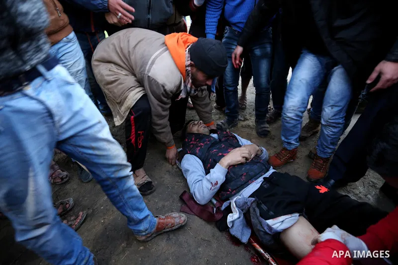 A wounded Palestinian protester is evacuated during clashes with Israeli security forces near the border with Israel in the east Gaza Strip, on January 19, 2018 as demonstrations continue over the US president's controve...