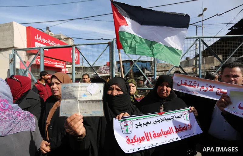 Palestinians take part in a protest outside a United Nations (UN) distribution centre in Rafah in the southern Gaza Strip, on January 21, 2018, following the decision by the US government to froze tens of millions of dol...