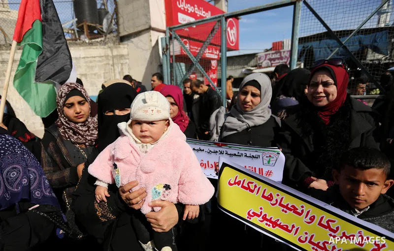Palestinians take part in a protest outside a United Nations (UN) distribution centre in Rafah in the southern Gaza Strip, on January 21, 2018, following the decision by the US government to froze tens of millions of dol...