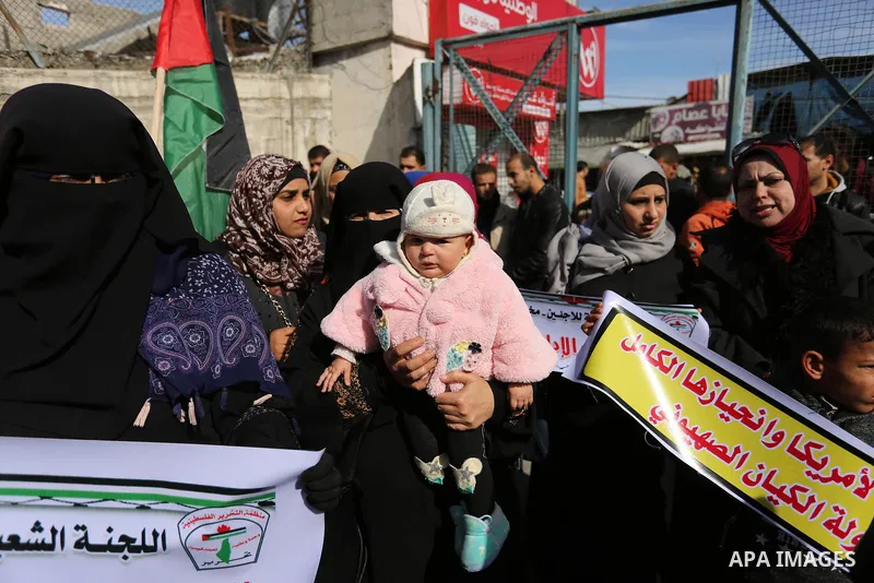 Palestinians take part in a protest outside a United Nations (UN) distribution centre in Rafah in the southern Gaza Strip, on January 21, 2018, following the decision by the US government to froze tens of millions of dol...