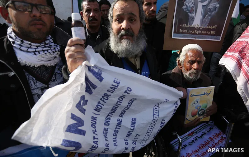 Palestinians take part in a protest outside a United Nations (UN) distribution centre in Rafah in the southern Gaza Strip, on January 21, 2018, following the decision by the US government to froze tens of millions of dol...