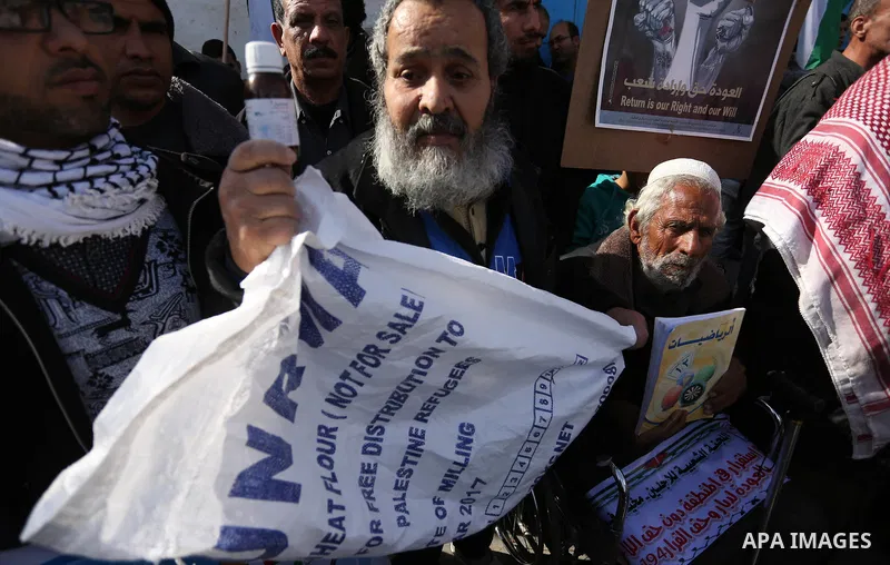 Palestinians take part in a protest outside a United Nations (UN) distribution centre in Rafah in the southern Gaza Strip, on January 21, 2018, following the decision by the US government to froze tens of millions of dol...