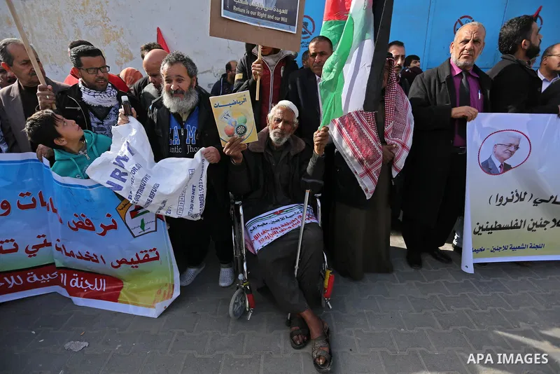 Palestinians take part in a protest outside a United Nations (UN) distribution centre in Rafah in the southern Gaza Strip, on January 21, 2018, following the decision by the US government to froze tens of millions of dol...