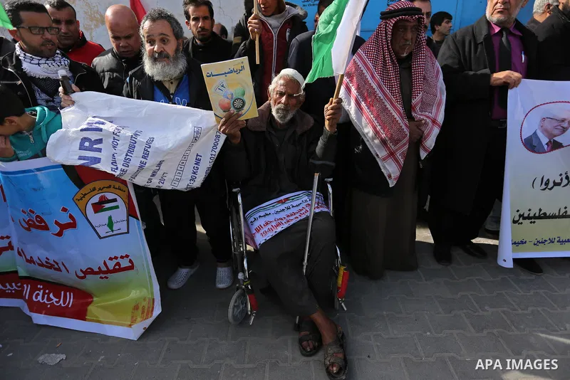 Palestinians take part in a protest outside a United Nations (UN) distribution centre in Rafah in the southern Gaza Strip, on January 21, 2018, following the decision by the US government to froze tens of millions of dol...