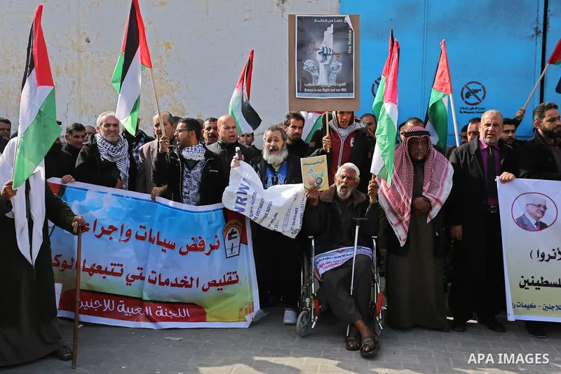 Palestinians take part in a protest outside a United Nations (UN) distribution centre in Rafah in the southern Gaza Strip, on January 21, 2018, following the decision by the US government to froze tens of millions of dol...
