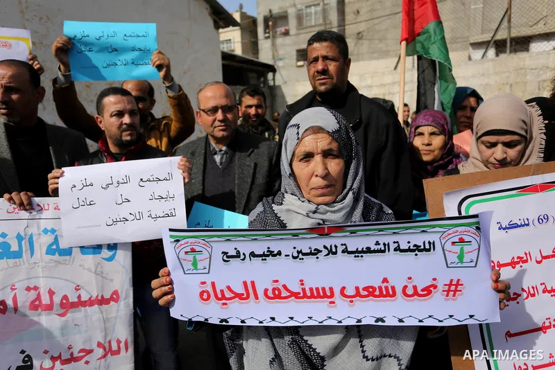 Palestinians take part in a protest outside a United Nations (UN) distribution centre in Rafah in the southern Gaza Strip, on January 21, 2018, following the decision by the US government to froze tens of millions of dol...