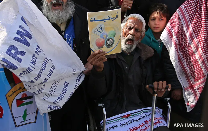 Palestinians take part in a protest outside a United Nations (UN) distribution centre in Rafah in the southern Gaza Strip, on January 21, 2018, following the decision by the US government to froze tens of millions of dol...
