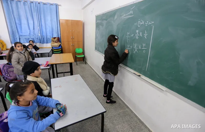 Palestinian schoolgirls attend a class at a school belonging to the United Nations Relief and Works Agency for Palestine Refugees (UNRWA) in Gaza City on January 22, 2018. Photo by Mohammed Asad