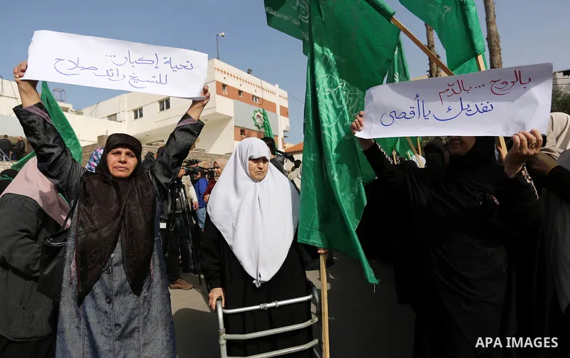 Palestinian women take part in a protest against US President Donald Trump's decision to recognise Jerusalem as the capital of Israel and to freeze tens of millions of dollars in contributions to the United Nations Relie...