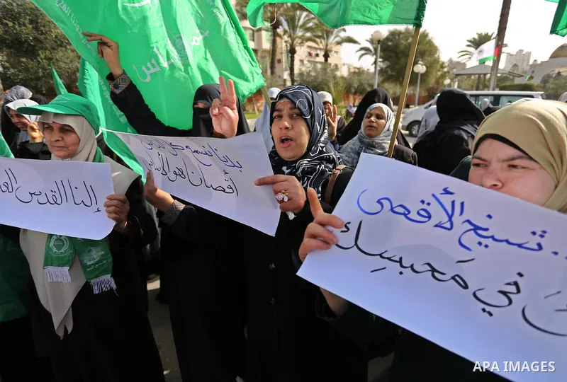 Palestinian women take part in a protest against US President Donald Trump's decision to recognise Jerusalem as the capital of Israel and to freeze tens of millions of dollars in contributions to the United Nations Relie...