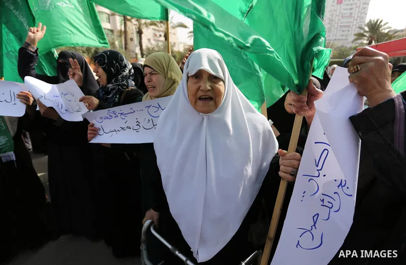 Palestinian women take part in a protest against US President Donald Trump's decision to recognise Jerusalem as the capital of Israel and to freeze tens of millions of dollars in contributions to the United Nations Relie...