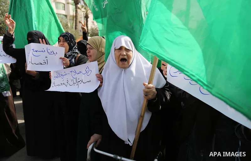 Palestinian women take part in a protest against US President Donald Trump's decision to recognise Jerusalem as the capital of Israel and to freeze tens of millions of dollars in contributions to the United Nations Relie...