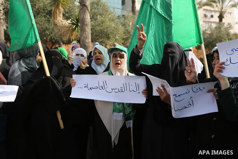 Palestinian women take part in a protest against US President Donald Trump's decision to recognise Jerusalem as the capital of Israel and to freeze tens of millions of dollars in contributions to the United Nations Relie...