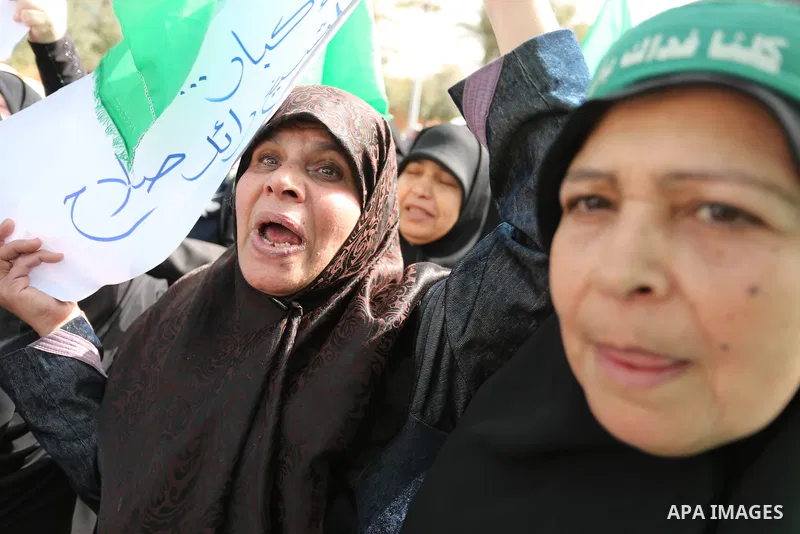 Palestinian women take part in a protest against US President Donald Trump's decision to recognise Jerusalem as the capital of Israel and to freeze tens of millions of dollars in contributions to the United Nations Relie...