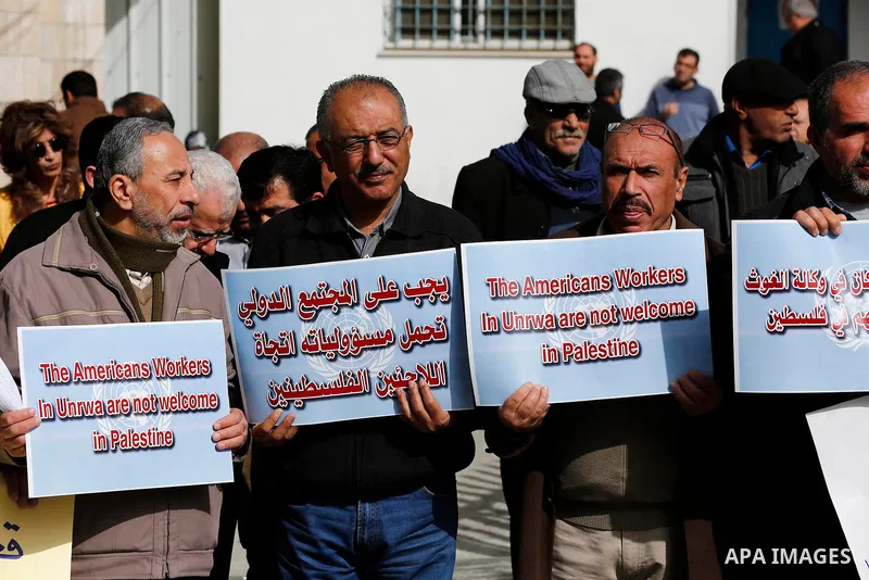 Palestinians take part in a protest in the town of Bethlehem in the occupied West Bank, on January 22, 2018 against freeze tens of millions of dollars in contributions to the United Nations Relief and Work Agency (UNRWA)...
