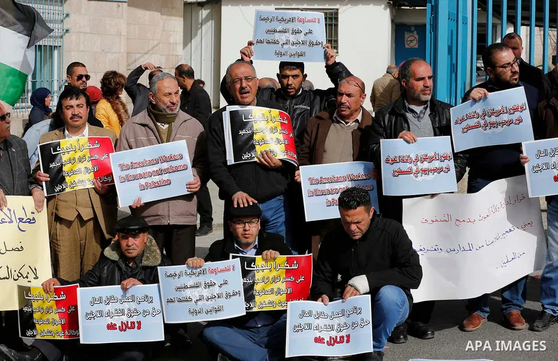 Palestinians take part in a protest in the town of Bethlehem in the occupied West Bank, on January 22, 2018 against freeze tens of millions of dollars in contributions to the United Nations Relief and Work Agency (UNRWA)...