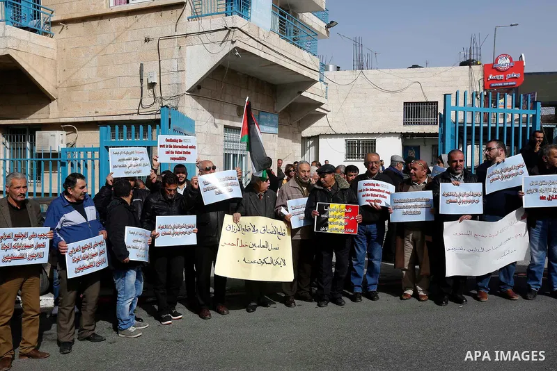 Palestinians take part in a protest in the town of Bethlehem in the occupied West Bank, on January 22, 2018 against freeze tens of millions of dollars in contributions to the United Nations Relief and Work Agency (UNRWA)...
