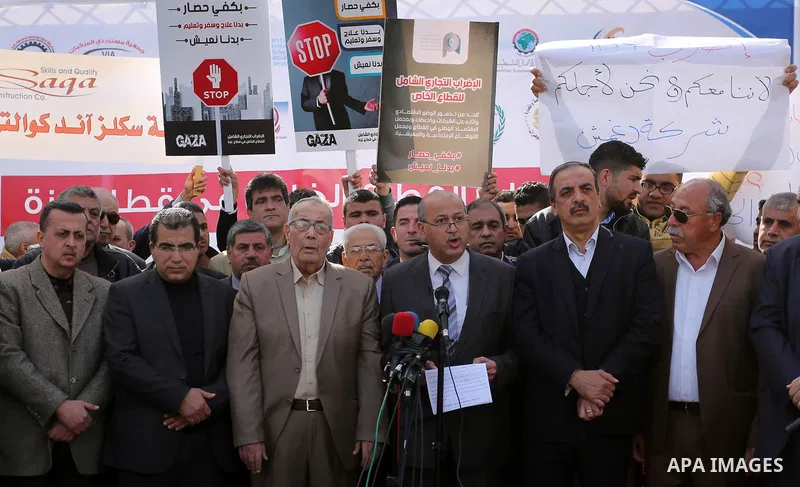Palestinians take part in a protest against the siege on Gaza and the economic situation, in Gaza city on January 22, 2018. Photo by Ashraf Amra