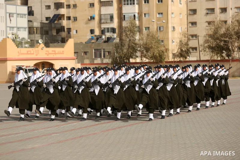 Palestinian police women show their skills during a graduation ceremony, in Gaza city on January 22, 2018. Photo by Ashraf Amra