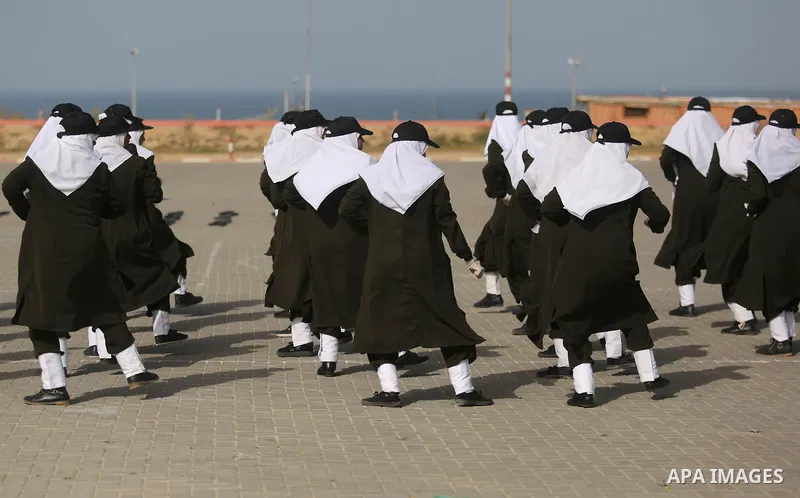 Palestinian police women show their skills during a graduation ceremony, in Gaza city on January 22, 2018. Photo by Ashraf Amra