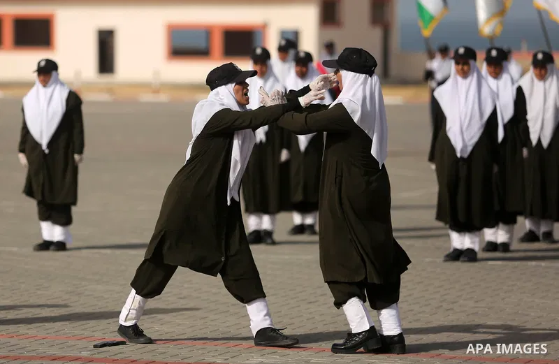 Palestinian police women show their skills during a graduation ceremony, in Gaza city on January 22, 2018. Photo by Ashraf Amra
