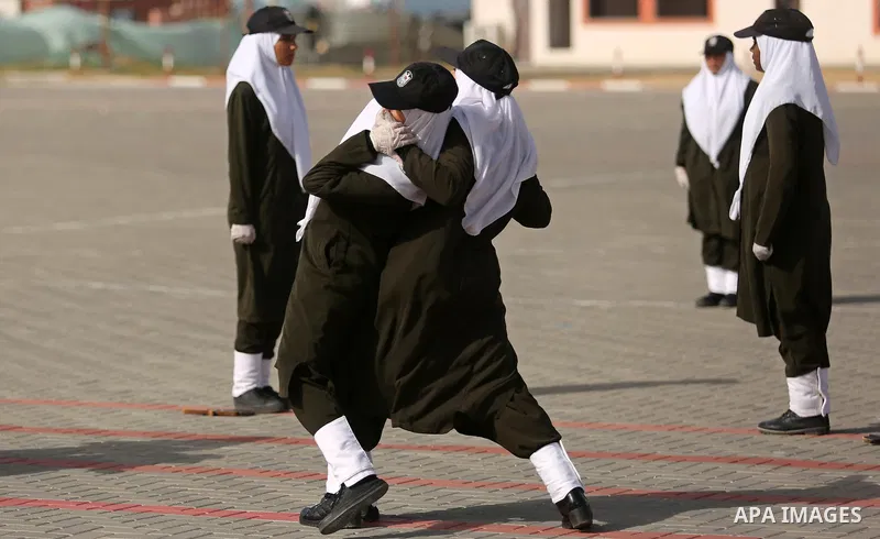 Palestinian police women show their skills during a graduation ceremony, in Gaza city on January 22, 2018. Photo by Ashraf Amra