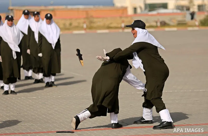 Palestinian police women show their skills during a graduation ceremony, in Gaza city on January 22, 2018. Photo by Ashraf Amra