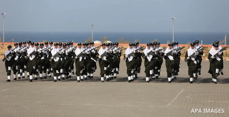 Palestinian police women show their skills during a graduation ceremony, in Gaza city on January 22, 2018. Photo by Atia Darwish