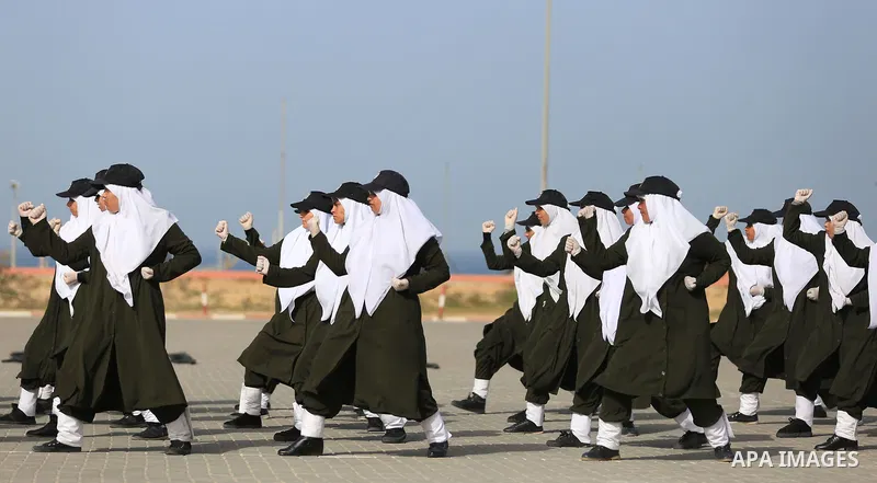 Palestinian police women show their skills during a graduation ceremony, in Gaza city on January 22, 2018. Photo by Atia Darwish