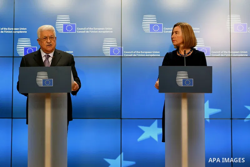 Palestinian President Mahmoud Abbas speaks as EU foreign policy chief Federica Mogherini listens prior to attend a EU foreign affairs council at the European Council in Brussels, January 22, 2018. Palestinian leader Mahm...