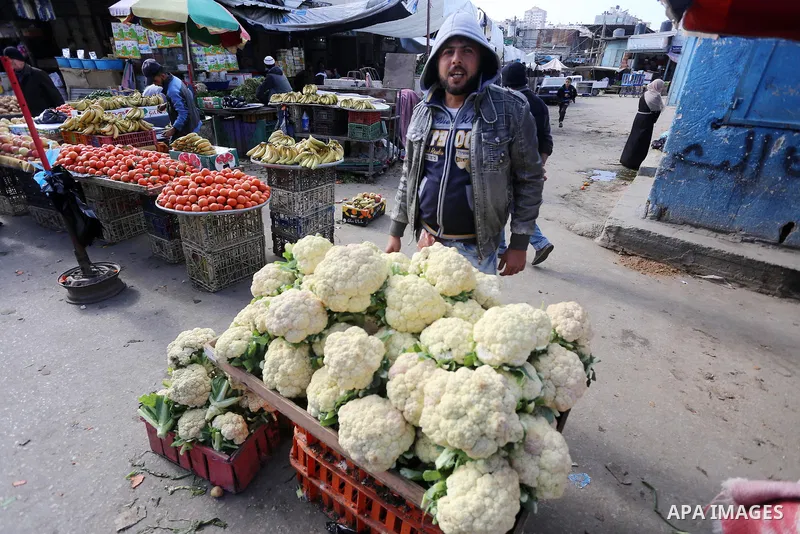 Palestinians shop at a market in Gaza city on January 23, 2018. A general commercial strike has hit the Gaza Strip to protest over worsening economic conditions and the decade-long Israeli blockade, amid warnings of an i...