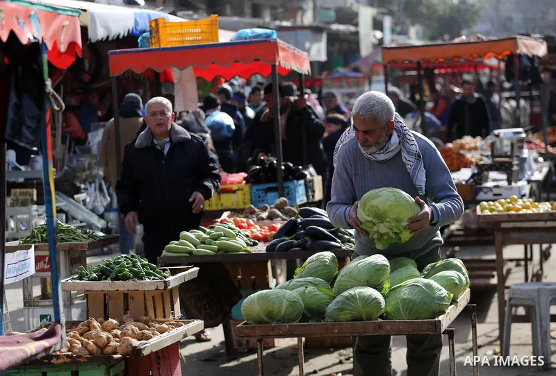 Palestinians shop at a market in Gaza city on January 23, 2018. A general commercial strike has hit the Gaza Strip to protest over worsening economic conditions and the decade-long Israeli blockade, amid warnings of an i...