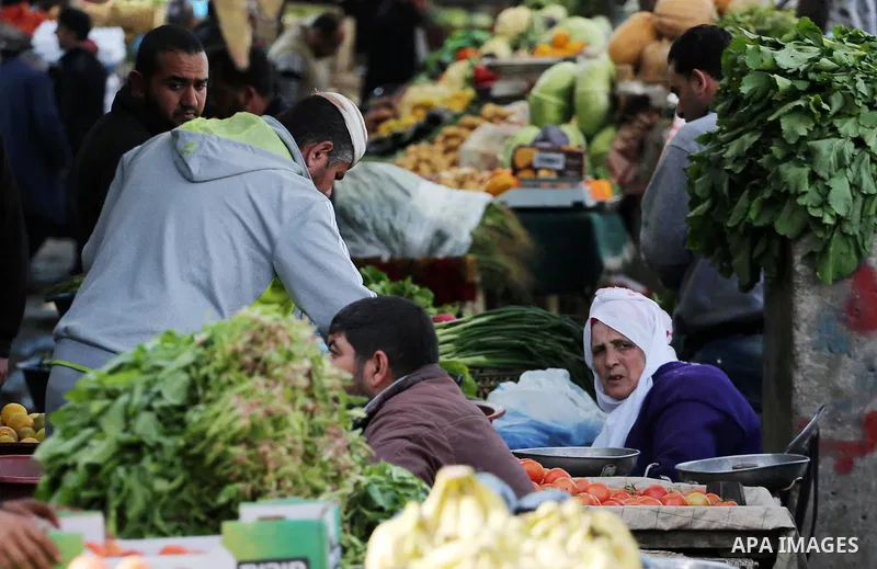 Palestinians shop at a market in Gaza city on January 23, 2018. A general commercial strike has hit the Gaza Strip to protest over worsening economic conditions and the decade-long Israeli blockade, amid warnings of an i...