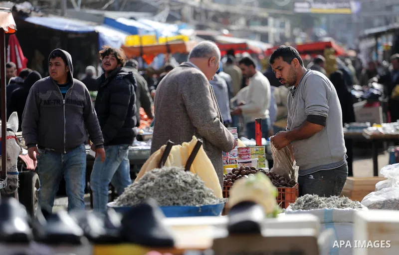 Palestinians shop at a market in Gaza city on January 23, 2018. A general commercial strike has hit the Gaza Strip to protest over worsening economic conditions and the decade-long Israeli blockade, amid warnings of an i...