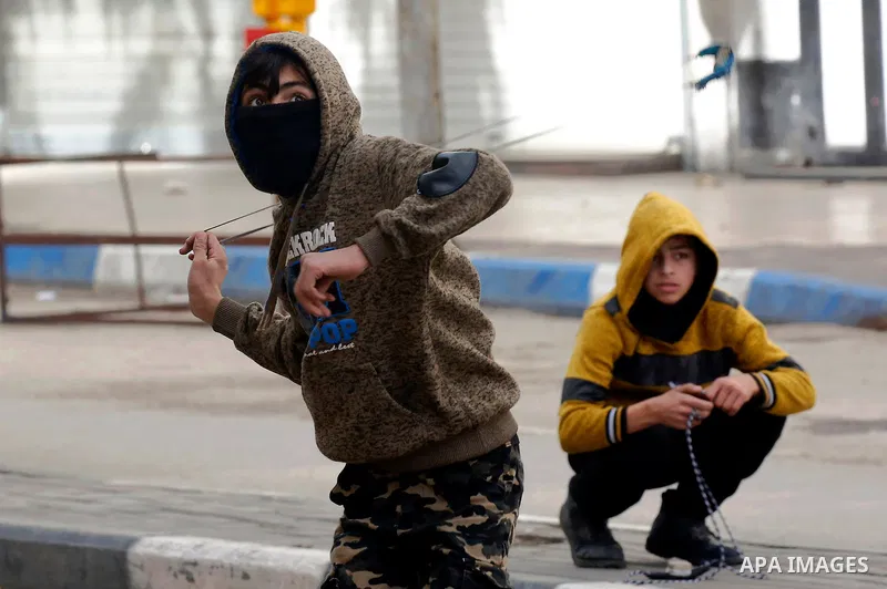 Palestinian protesters clash with Israeli security forces in the city of Hebron in the occupied West Bank, on January 23, 2018, as protests erupted following US Vice Presidents reaffirmation of US President Donald Trump'...