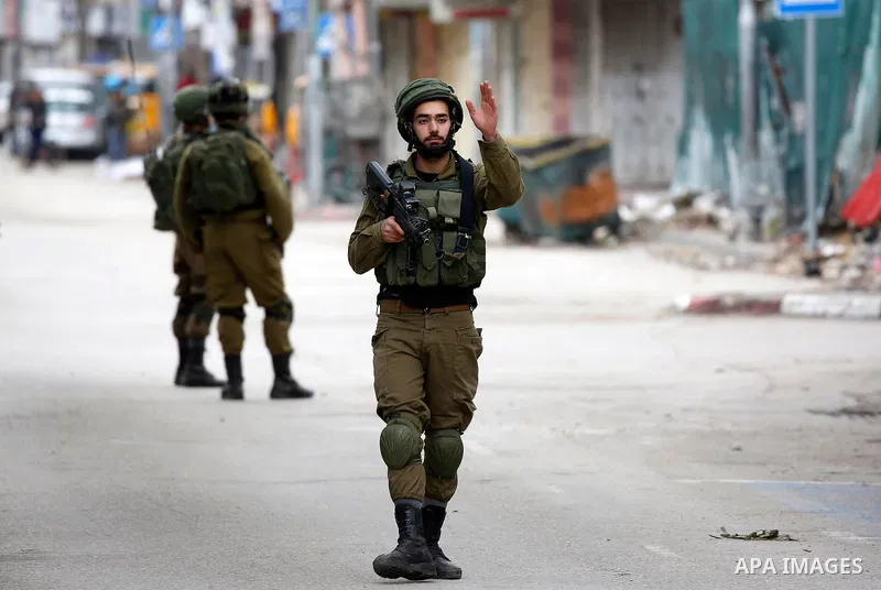 Israeli security forces take position during clashes with Palestinian protesters in the city of Hebron in the occupied West Bank, on January 23, 2018, as protests erupted following US Vice Presidents reaffirmation of US...