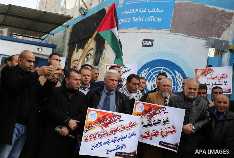 Palestinians take part in a protest against freeze tens of millions of dollars in contributions to the United Nations Relief and Work Agency (UNRWA), in Gaza city on January 23, 2018. The US State Department froze two pl...