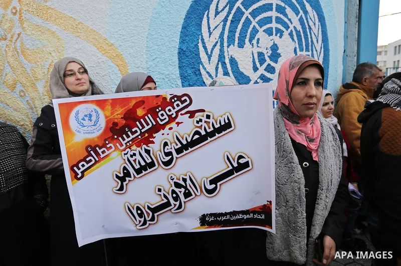 Palestinians take part in a protest against freeze tens of millions of dollars in contributions to the United Nations Relief and Work Agency (UNRWA), in Gaza city on January 23, 2018. The US State Department froze two pl...