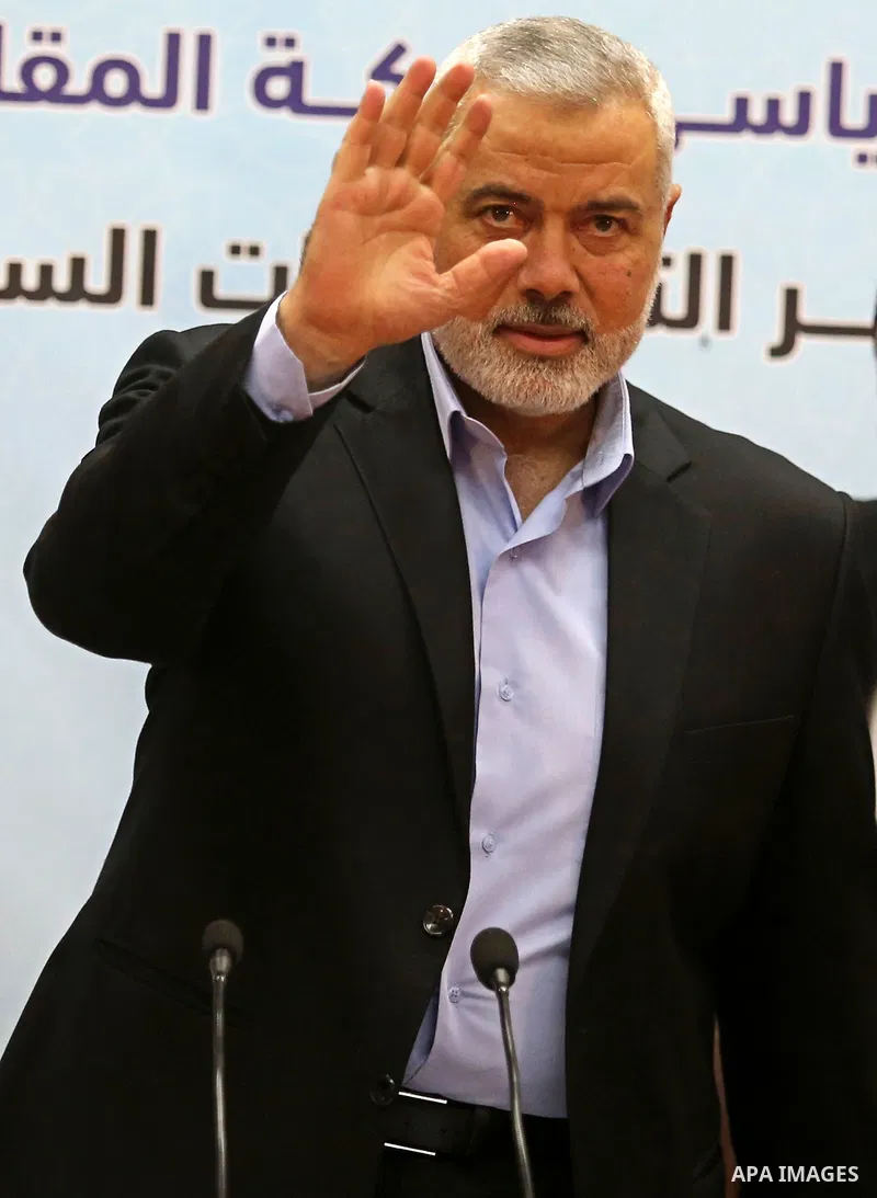 Hamas' leader Ismail Haniya waves before a press conference in Gaza city on January 23, 2018. Photo by Ashraf Amra