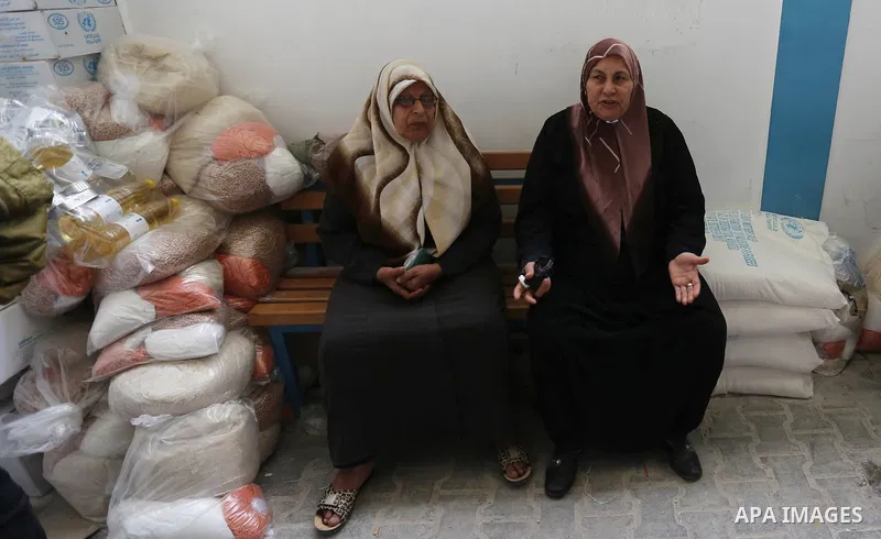 Palestinian refugees wait to receive aid at a United Nations food distribution center in Jabalia in the northern Gaza Strip on January 24, 2018. U.S. President Donald Trump is preparing to withhold tens of millions of do...