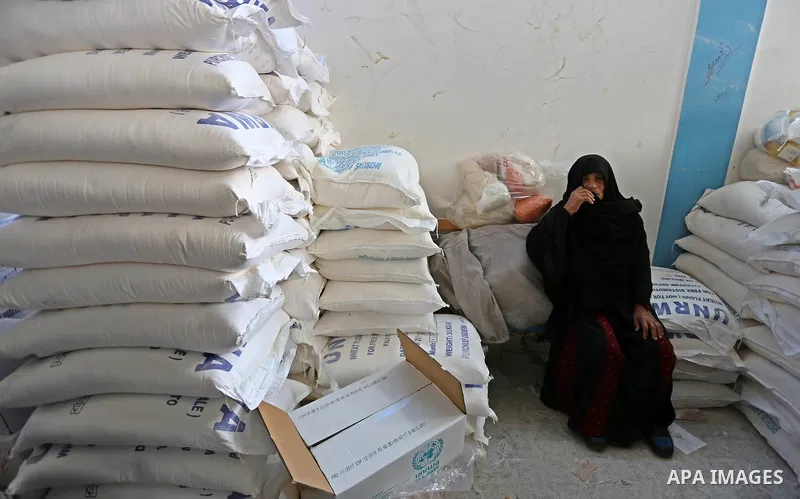A Palestinian refugee waits to receive aid at a United Nations food distribution center in Jabalia in the northern Gaza Strip on January 24, 2018. U.S. President Donald Trump is preparing to withhold tens of millions of...