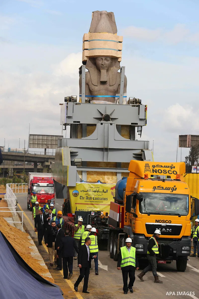 The 3,200-year-old colossal statue of King Ramses II is seen during its transfer to the main entrance of the Grand Egyptian Museum in Cairo's twin city Giza on January 25, 2018. Photo by Amr Sayed
