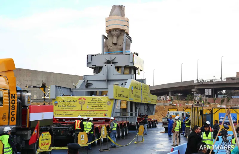 The 3,200-year-old colossal statue of King Ramses II is seen during its transfer to the main entrance of the Grand Egyptian Museum in Cairo's twin city Giza on January 25, 2018. Photo by Amr Sayed