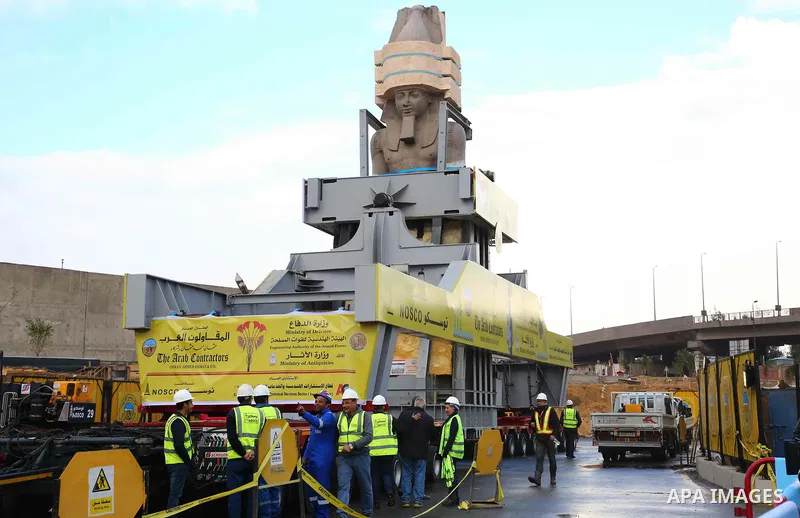 The 3,200-year-old colossal statue of King Ramses II is seen during its transfer to the main entrance of the Grand Egyptian Museum in Cairo's twin city Giza on January 25, 2018. Photo by Amr Sayed